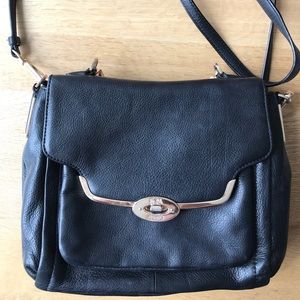 Black leather bag with gold hardware